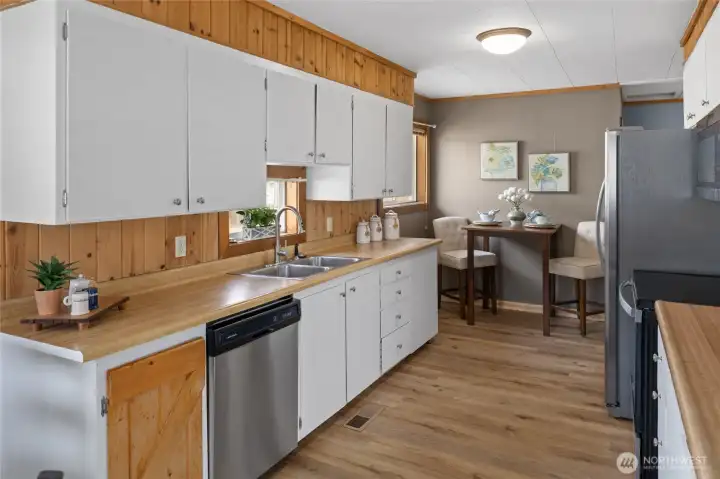 Stainless steel appliances through out kitchen.
