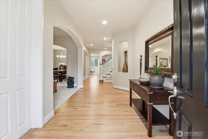 Refinished hardwood floors paired with fresh paint throughout create a crisp, move-in-ready interior with timeless appeal.