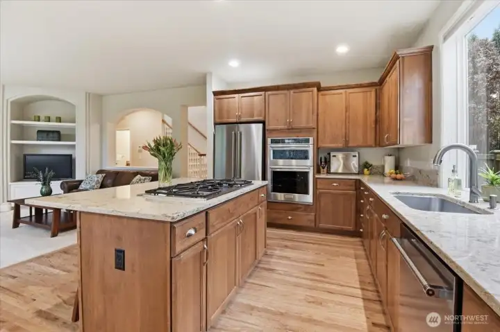 New stainless-steel refrigerator, oven, microwave and dishwasher.