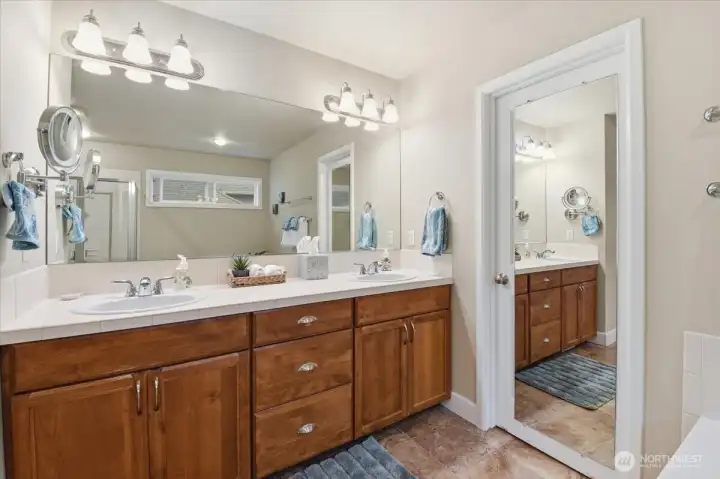 Well-appointed bathroom featuring a dual vanity.