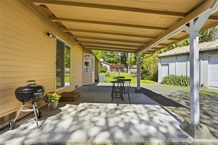 Enjoy a peaceful setting with mature landscaping and expansive grounds offering endless possibilities for outdoor living, storage, or future projects