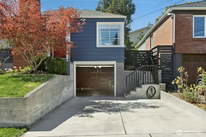 Convenient new set of stairs lead to the side door and the bakyard.