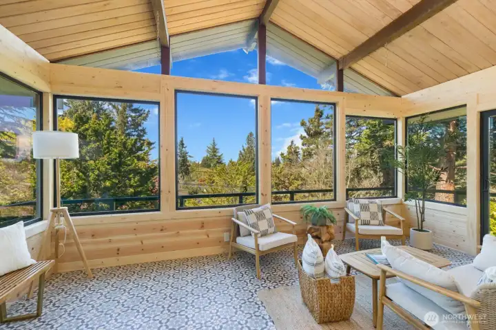 Western facing sunroom w/ views of the Olympics & amazing sunsets.