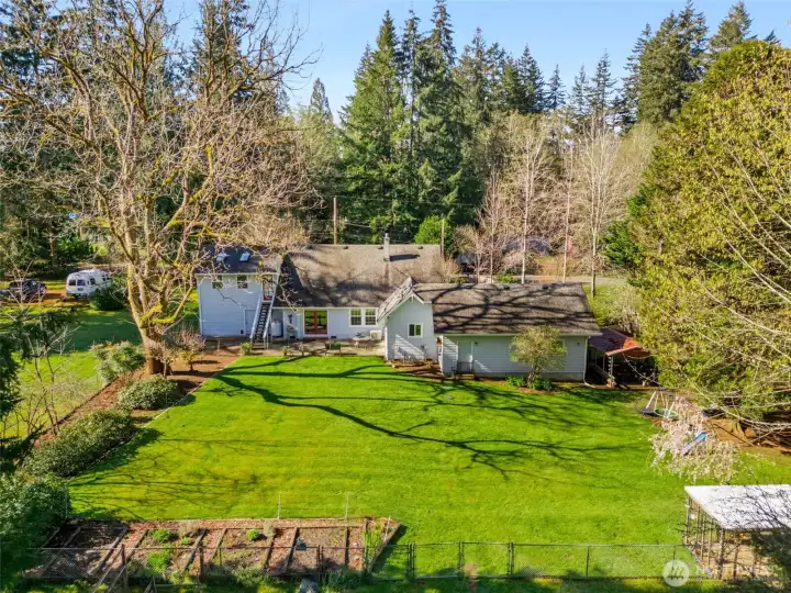 Rear view of home and yard.
