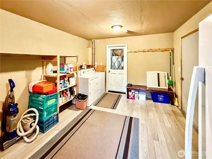 Huge laundry/pantry conveniently located off of kitchen with access to garage.