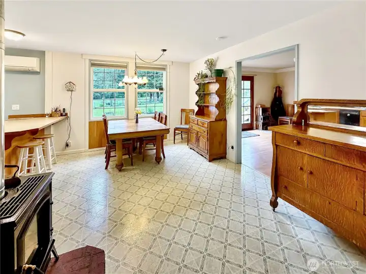 View from living room looking into dining area. Access to family room to the right and kitchen to the left.