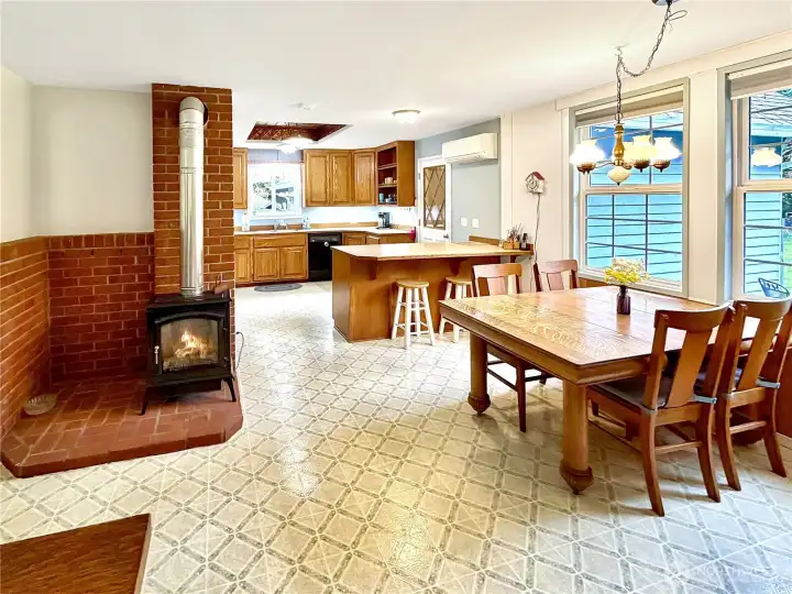 Freestanding propane stove with brick surround keeps things comfortable.