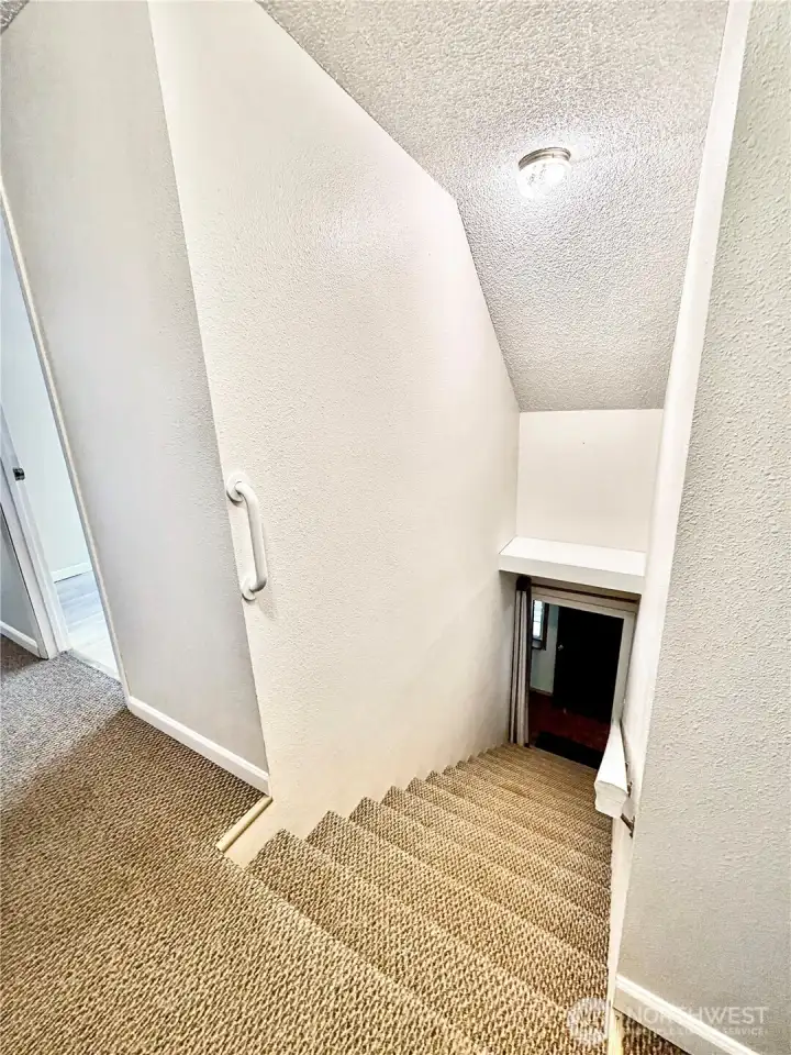 View of stairway going down.