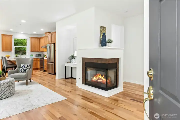 This wonderfully open Chelan model floor plan features gleaming hardwood floors and a cozy gas fireplace.