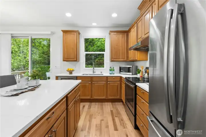 Beautiful quartz countertops & backsplash installed in 2025. New Hunter Douglas top down bottom up blind installed above sink in 2026. Pull out storage organizers installed in cabinets in 2024.