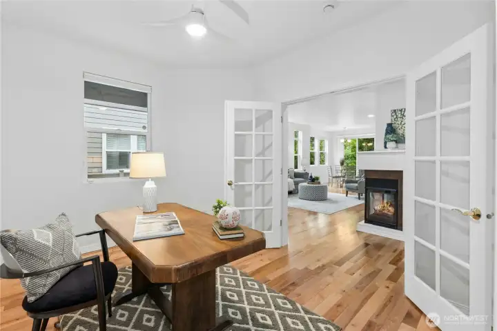 Stylish remote controlled ceiling fan with light installed in 2024. Window overlooks entry.