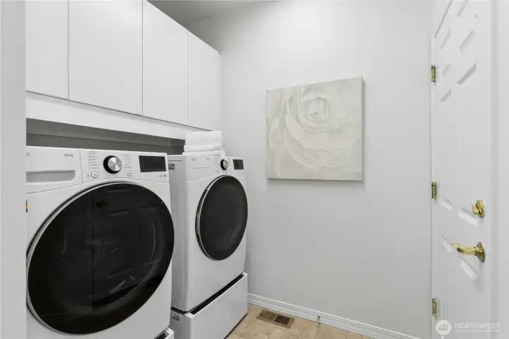 Newly purchased in 2025, LG washer & dryer stay with house. Wall mounted storage cabinets installed in 2026. Solar tube adds natural light.