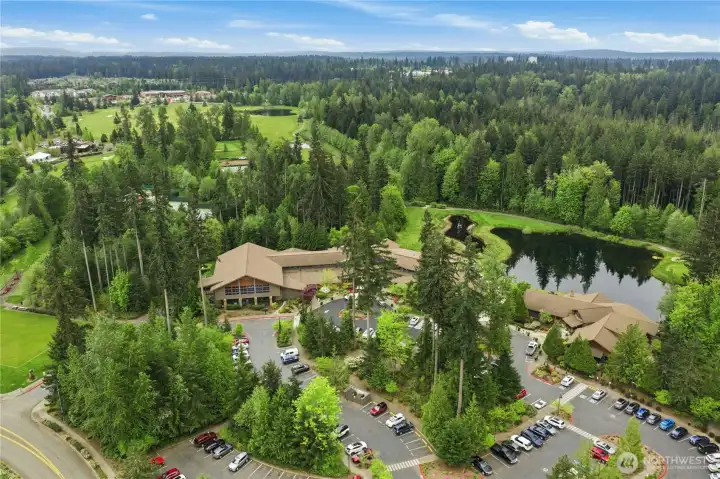 Trilogy's Cascade Club and Center for Well Being offer just about every activity and amenity you could desire! Pickleball, tennis, & basketball courts are tucked into trees behind indoor pool & fitness center. Bocce field is at left edge of image. Nearby public Golf Club and Village at Redmond Ridge pictured in distance.