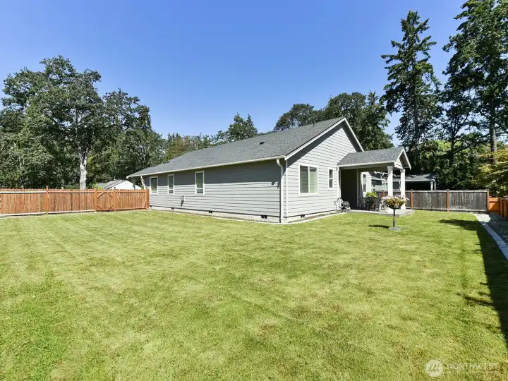 The home was place off center on the lot to allow plenty of room for gardening, playing or maybe RV parking.