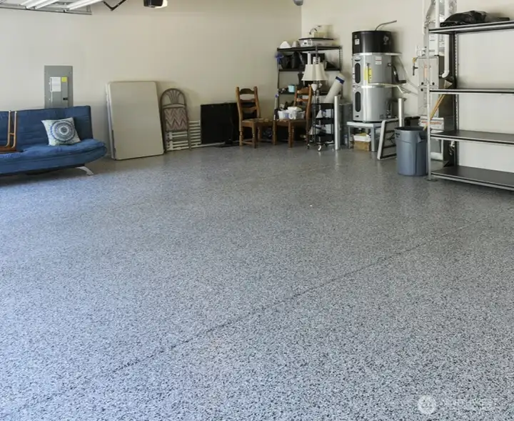 Epoxy sealed floor in garage gives a good looking, durable finish.