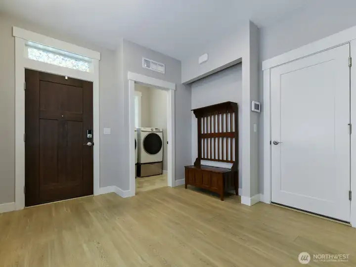 Laundry is located just inside the front and garage doors to limit noise to the living areas.