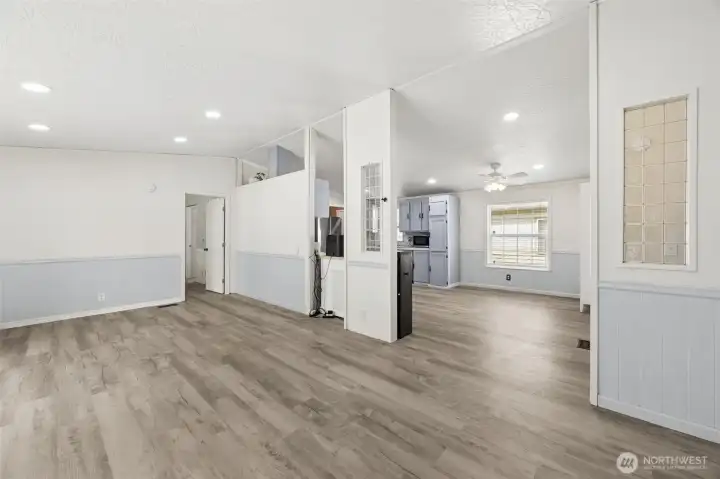 Open-concept living area creates seamless flow throughout the home. It’s ideal for gatherings and everyday comfort. The layout feels spacious and connected. Vaulted ceilings elevate the living space with openness and light. They create a spacious, airy feel the moment you walk in. Perfect for both relaxing and entertaining.