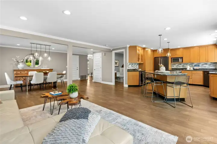 Daily life naturally centers around these open living spaces, where the kitchen, dining, and gathering areas stay connected without feeling crowded. The layout makes it easy to stay part of the conversation whether preparing meals, hosting friends, or simply settling in for a quiet evening at home.