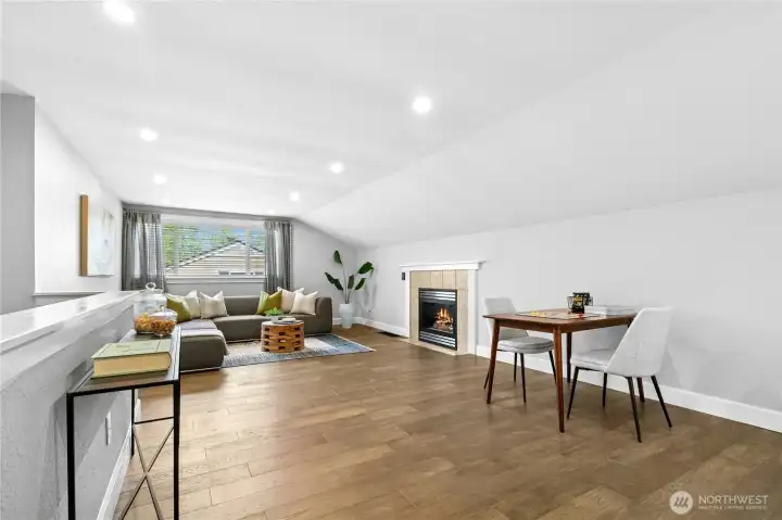 The upper level bonus room offers a flexible retreat space with expansive floor area and a cozy gas fireplace that adds warmth and comfort. Perfect for movie nights, games, a media room, or quiet workspace, the layout easily adapts to a variety of needs.