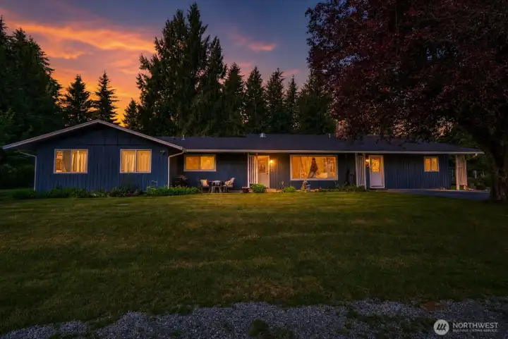 Stunning curb appeal — this beautiful single-story home glows at twilight