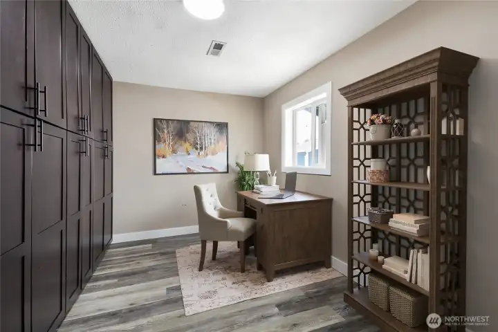 Office/bonus room with gorgeous dark wood built-in shelving