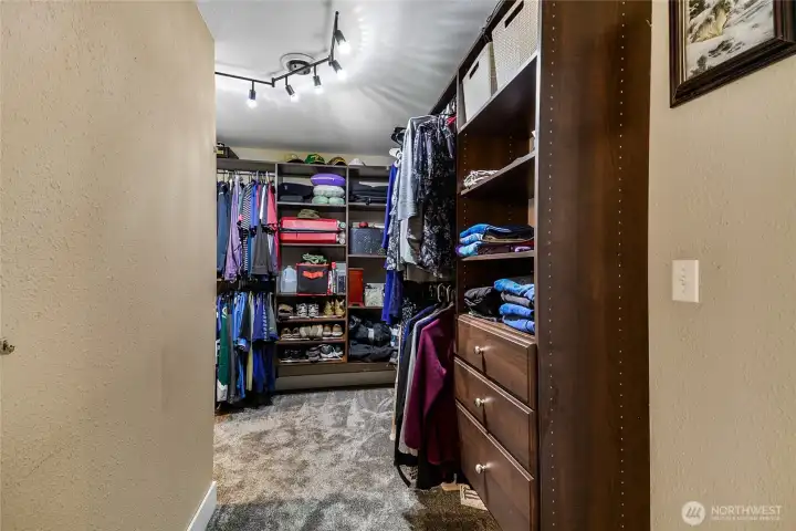 Walk-in closet with custom built-in organizer — room for everything