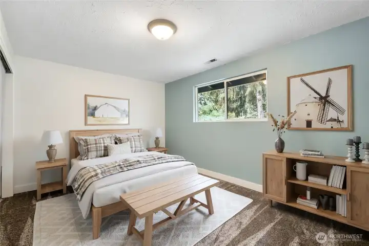 Bedroom with soft, peaceful tones and great natural light