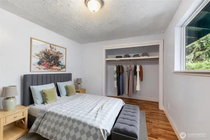 Another bedroom that is light and bright