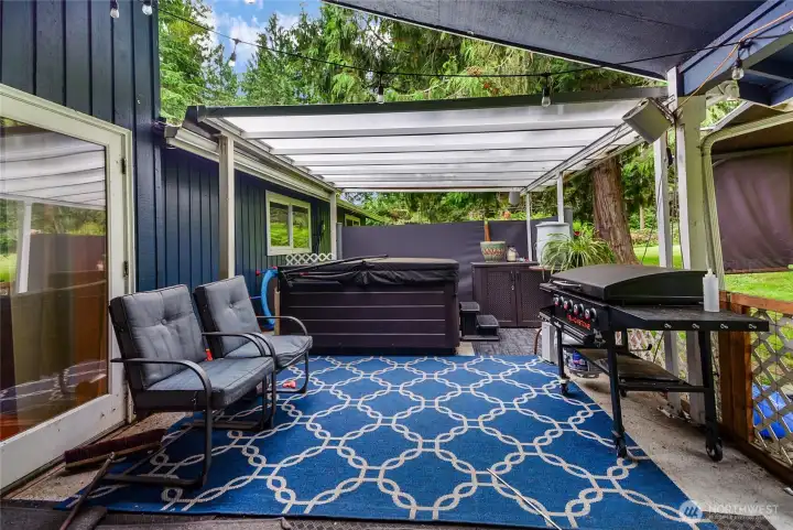 Covered outdoor patio/pergola — perfect for entertaining year-round.  Hot tub Included!