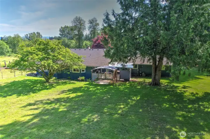 Aerial view — home nestled beautifully among mature trees