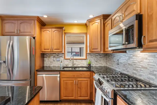 Updated kitchen, granite counters, tile back plash, stainless appliances, propane stove.