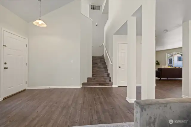 Entry; Staircase splits to bonus room on the left, and rooms on the right.