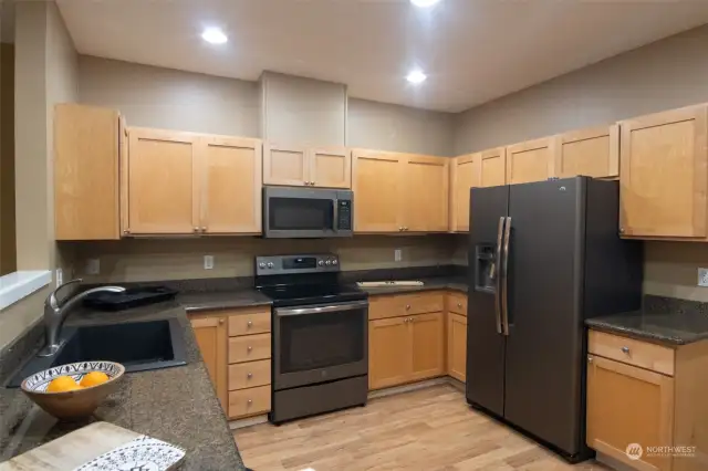 Black Stainless appliances included.  Built in microwave.  Lots of counter space.   Granite countertops.