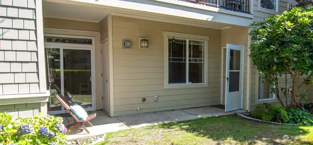 Beautiful sunny patio, Cheerful place to relax and unwind.  Sliding glass door off of the primary bedroom.  Screen door leads to family room.