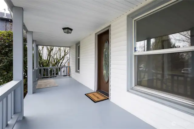 Charming covered front porch across the width of the house