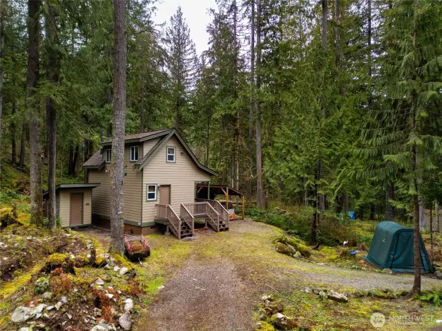 Storage shed to left of home offers additional storage for garden tools and other items.