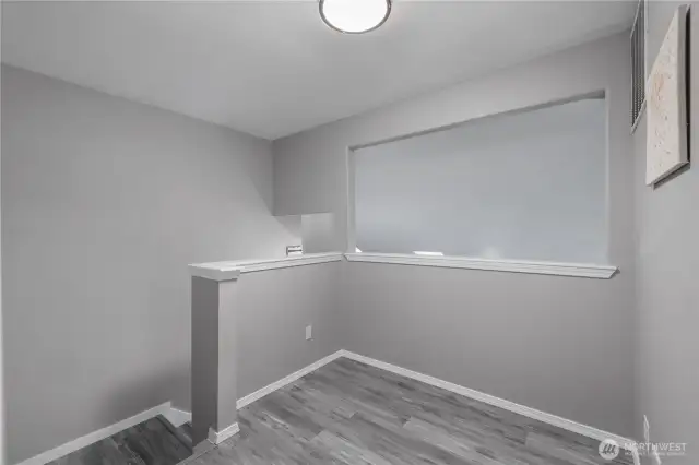 Bonus area at the top of the stairs, great place for a desk.
