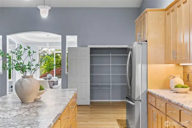 A full-sized pantry offers additional kitchen storage.