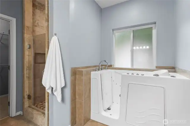 Have you ever wished for a walk-in bathtub? This particular model features jets and includes seat for relaxation.