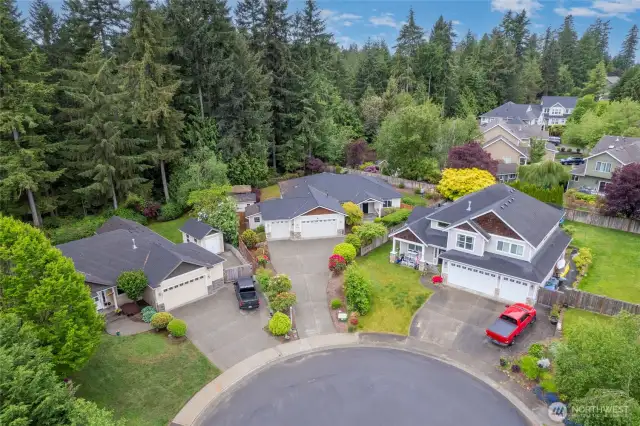 Setback for added privacy, this home provides parking galore on the driveway and in this quiet cul-de-sac.