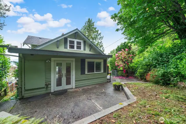 Rear of the home photo showing swing on the left where they would enjoy the view.
