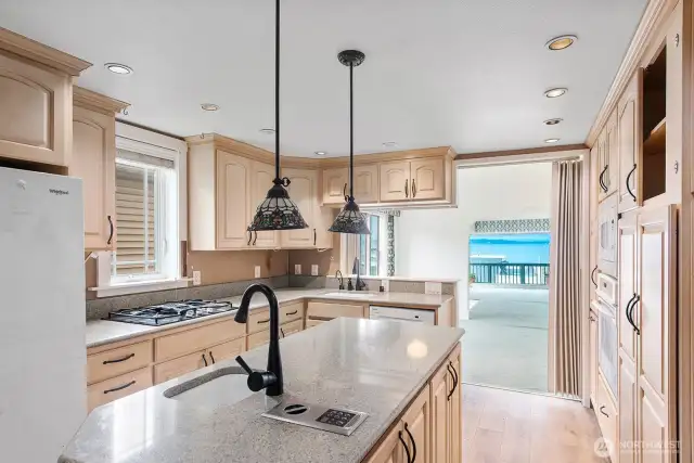 The kitchen has plenty of counterspace and cupboards.