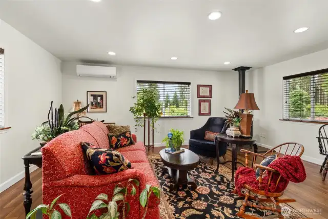 Charming interior with ductless mini split heat pump for hot and cold air. And a woodburning fireplace.