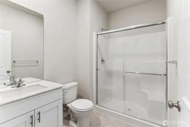 spacious, light and bright bathroom on the main level!