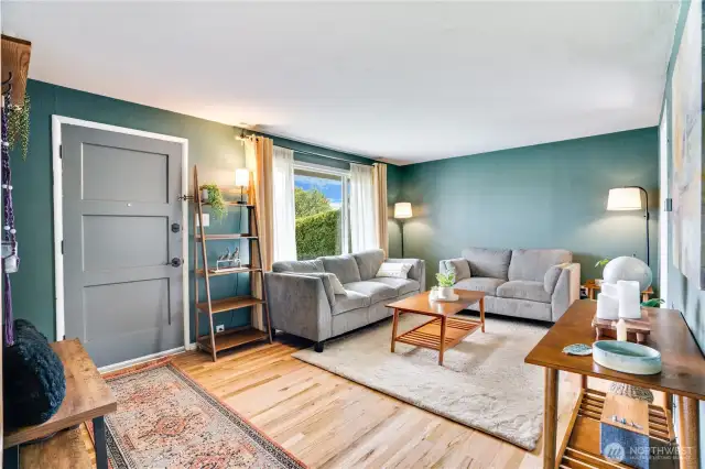 This living room has been freshly painted (trim too!) and is a cozy spot to chat with friends or catch a Friday night movie at home.