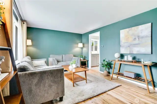 This living room is truly the heart of the home! The large front window and no VOC finish on the hardwoods create a peaceful retreat the second you open the door.