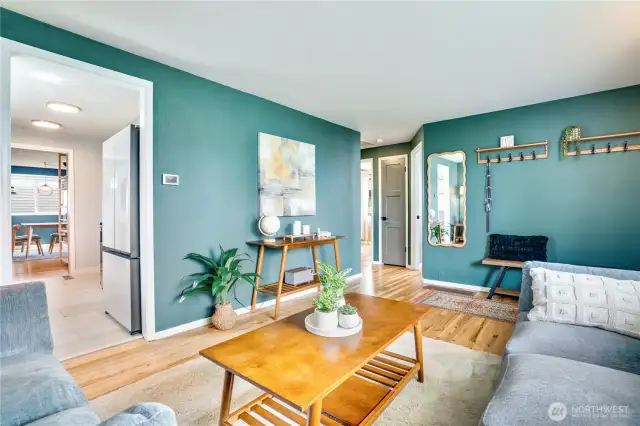 Transition from one room to another with ease since you're on one floor! To the right of the living room are the bedrooms and bath, to the left you'll find the kitchen, dining room and utility area.