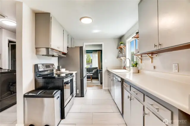 Vinyl flooring, stainless appliances and an easy layout make this kitchen perfectly turnkey. The fridge is less than a year old - the extra fancy kind!