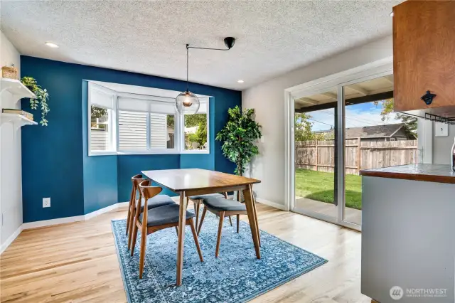 This dining room is basically its own entertainment space with easy access to the backyard, an abundance of natural light and quick access to the built-in wine bar. Note the refinished hardwoods and stylish accent wall. Cheers!