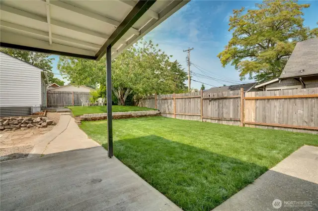 The covered patio off the dining room allows for a comfortable year-round grilling spot and sets the stage for a great al fresco dining experience!